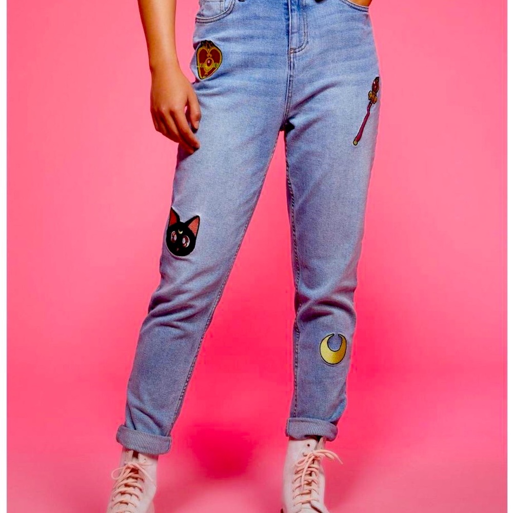 Pink,Yellow,Red, and Blue Sailor Moon jeans woth a little stain on it.